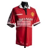 A Manchester United 1998-99 Treble Season replica jersey signed by the 'Holy Trinity' George Best,