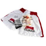 Roberto Duran signed boxing glove and trunks,