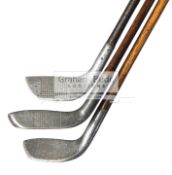 Three aluminium headed hickory shafted putters circa 1910, a Standard Golf Co.