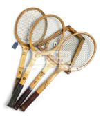 A collection of seven tennis racquets,