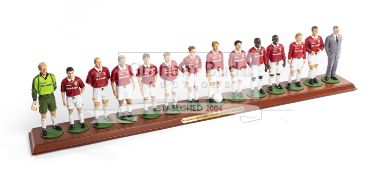 A Danbury Mint Manchester United Champions of Europe 1999 Team figurines with Alex Ferguson,