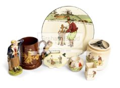 A group of golf ceramics, comprising a Royal Crown Derby figurine of a lady golfer, height 18cm.