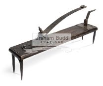 A 19th century Knurr and Spell launcher, wood and cast iron construction,