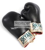 A pair of vintage boxing gloves signed by Henry Cooper,