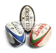 Three signed rugby balls, comprising a 1990s England international team,