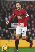 A group of six photographs signed by Manchester United players past and present,