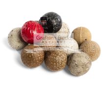 A collection of 23 golf balls, including an Arch Colonel, good, with unusual patterning,