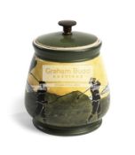 Taylor-Tunnicliffe pottery golfing tobacco jar & cover circa 1900, decorated primarily on yellow,