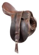 A leather polo saddle developed and used by Charles Robertson "Bob"Skene,