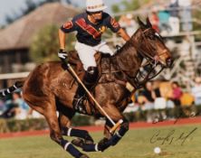 A signed colour photograph of Mexican Polo player Carlos Gracida in action,