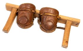 A pair of vintage leather polo player's knee pads,
