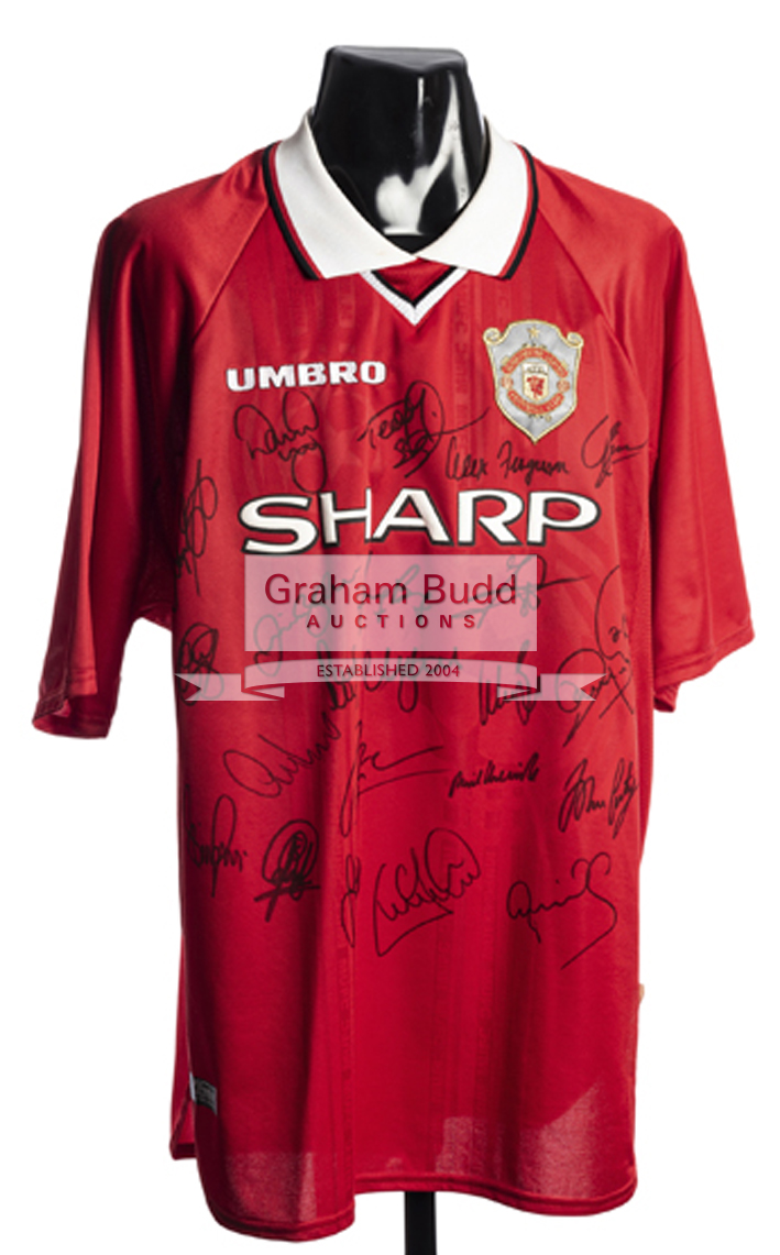 A pair of team-signed Manchester United Champions League Final winning replica jerseys for 1999 and