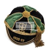 A rugby cap dated 1933-37, in green & black quarters,