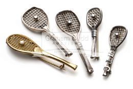 A group of five tennis racquet brooches,