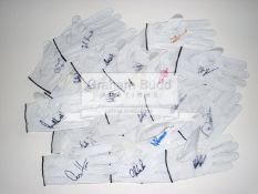A collection of 46 signed white leather golf gloves, comprising Angel Cabrera, Doug Sanders,