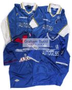 A group of four Chelsea FC team-signed F.A.