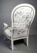 An England 2003 Rugby World Cup Champions commemorative white leather armchair fully-signed by the