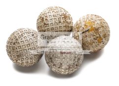 Four mesh pattern rubber core golf balls, circa 1930's, a Michelin, a Teemee, the others unnamed,