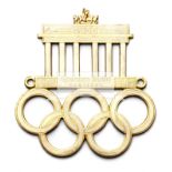 Three Olympic Games commemorative car grille badges, the first a Los Angeles 1932,
