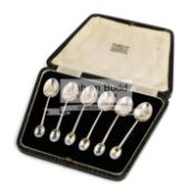 A suite of silver Golfer enameled coffee spoons,