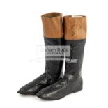 A pair of signed Champion jockey Michael Roberts leather boots, the black and brown leather boots,