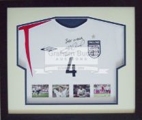 England Steven Gerrard signed and framed shirt measuring 58 by 66.5cm.