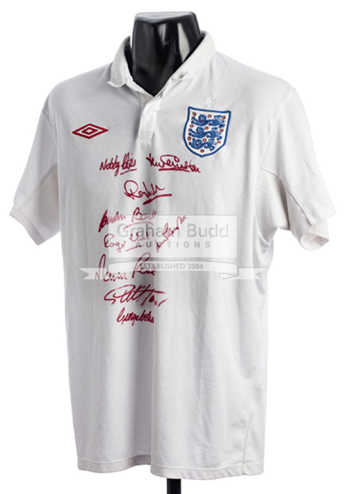 A white England replica jersey signed by nine members of the 1966 World Cup winning team,