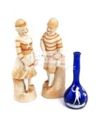 A pair of German bisque figures of tennis players,