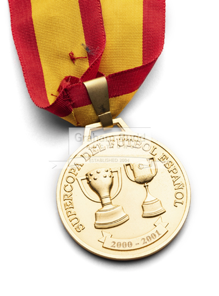 A gold medal awarded to Zindine Zidane for winning the 2001 Supercopa de Espana, with Real Madrid,