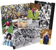 A collection of eight photographs signed by international footballers,