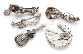 Five tennis related brooches comprising of a horseshoe and racquet with gilt floral highlights,