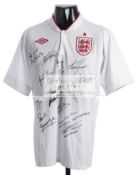 An England football legends signed white jersey, signed in black marker pen by Bobby Charlton,