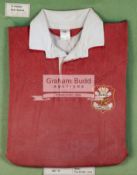 A framed Phil Bennett Llanelli RFC shirt,