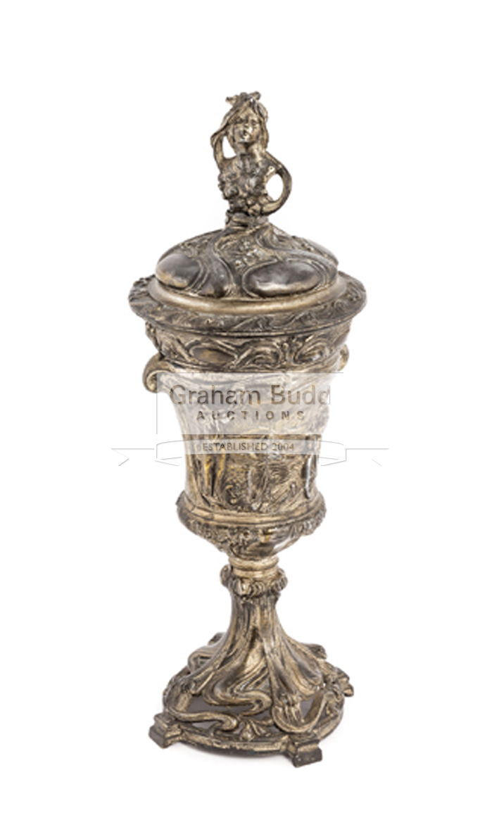 A Britannia metal sporting cup with cover, the foliate embossed cover with female finial,