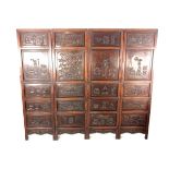 A large Chinese four fold carved hardwood screen, late 19th/early 20th century.