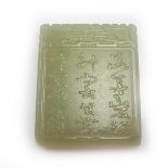 A Chinese celadon jade pendant plaque.