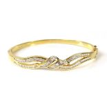 18 ct yellow gold diamond set bangle.