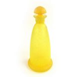 A yellow splatter glass decanter, 20th century.