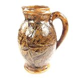 A Martin Brothers glazed brown stoneware jug, late 19th century, circa 1870s.