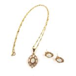 9 ct yellow gold opal pendant necklace and earrings. The pendant set with an oval opal cabochon in