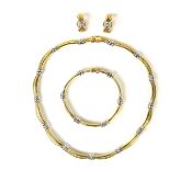 18 ct yellow and white gold diamond set demiparure.