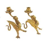 A pair of bras dragon candlesticks, probably late 19th century.