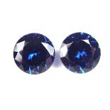 Pair of loose circular cut synthetic sapphires.