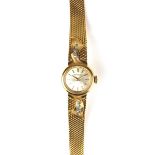 Movado 18 ct yellow gold diamond set lady's watch.