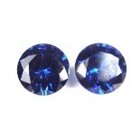 Pair of loose circular cut synthetic sapphires.