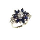 Sapphire and diamond flower cluster ring.