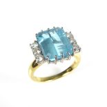 18 ct yellow gold blue topaz and diamond ring.