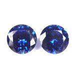 Pair of loose circular cut synthetic sapphires.