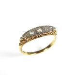 18 ct yellow gold five stone diamond ring.