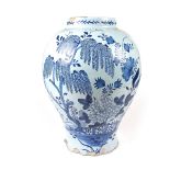 A large Delft blue and white baluster vase, 19th century or earlier.